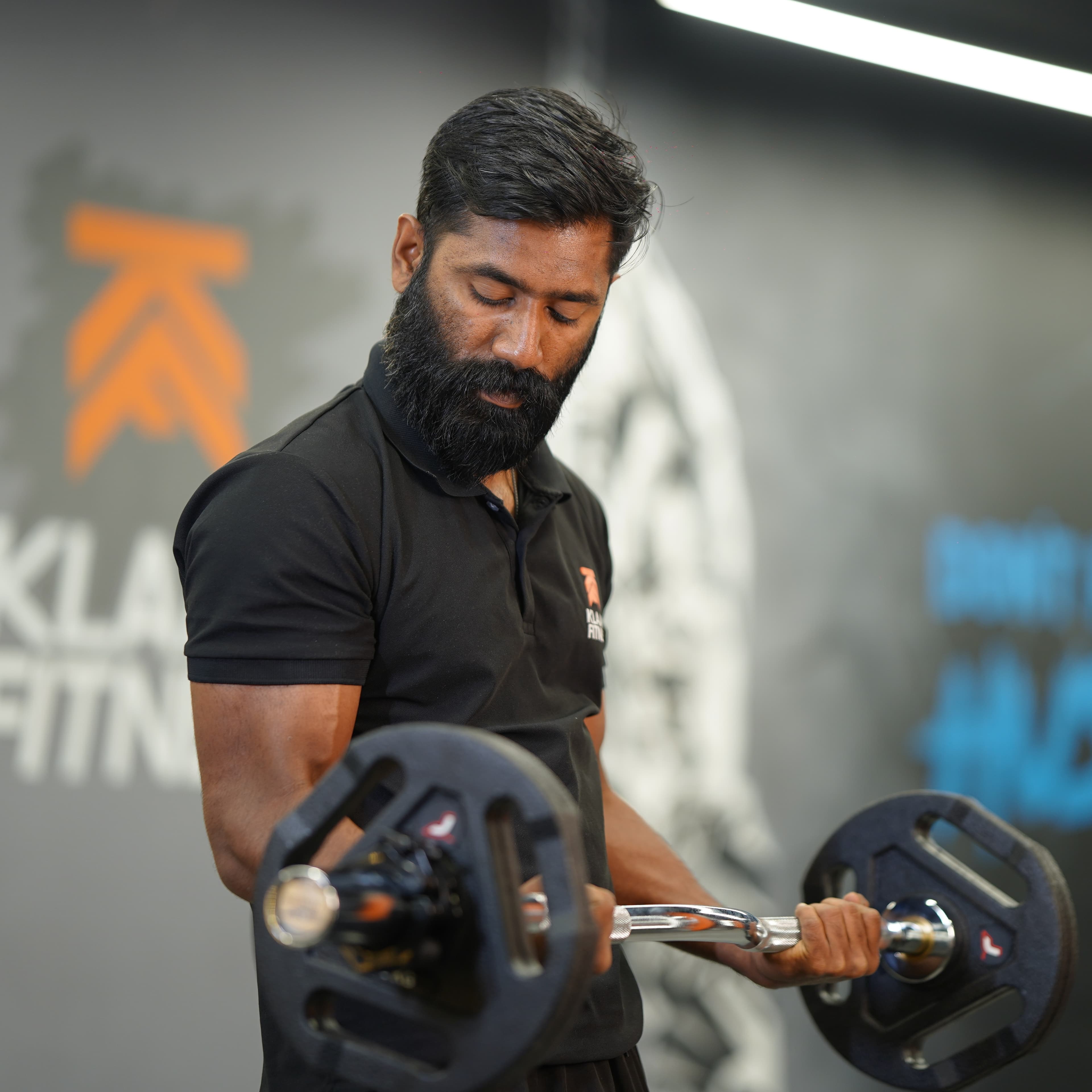 Trainer helping client